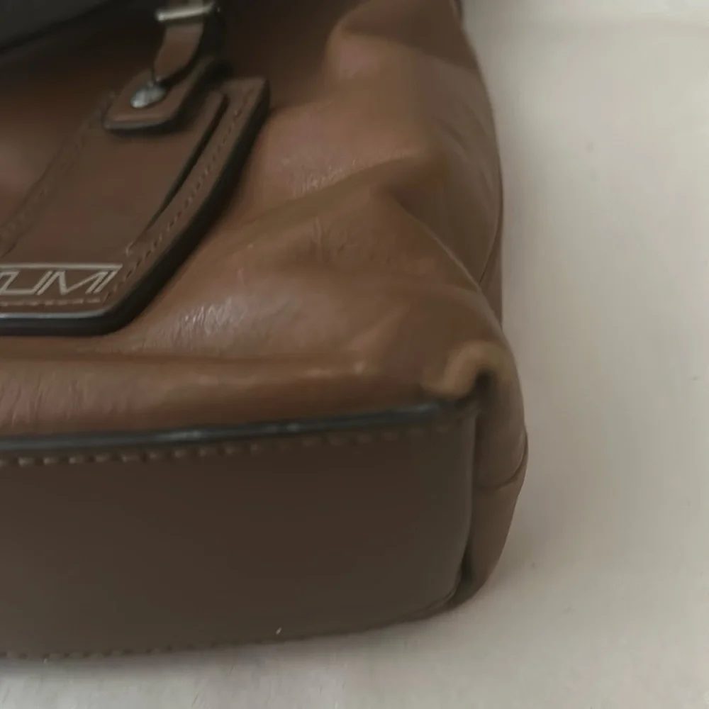 TUMI; Brown Leather Expandable Laptop Bag.